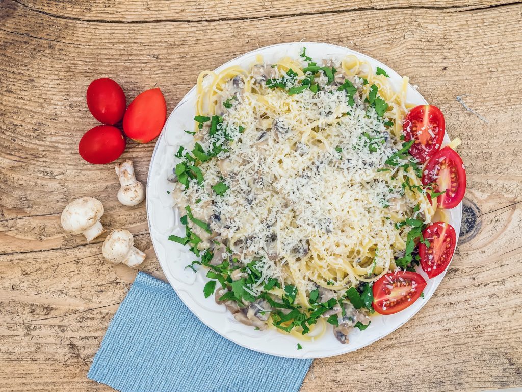 Fresh Italian pasta with mushrooms and cream sauce